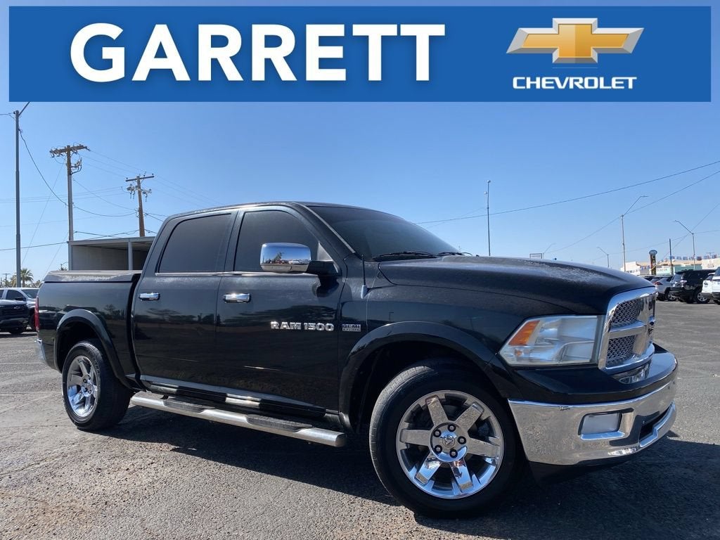 2012 RAM 1500 Laramie in Black — front three-quarter view