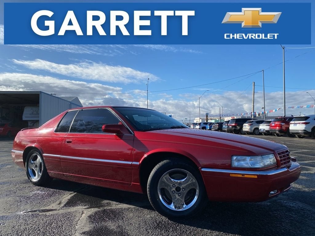 1997 Cadillac Eldorado Touring in Pearl Red — front three-quarter view