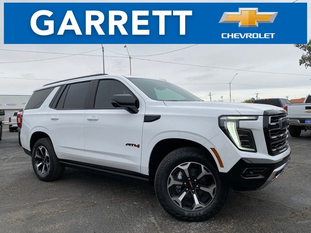 2026 GMC Yukon AT4 in Summit White — front three-quarter view