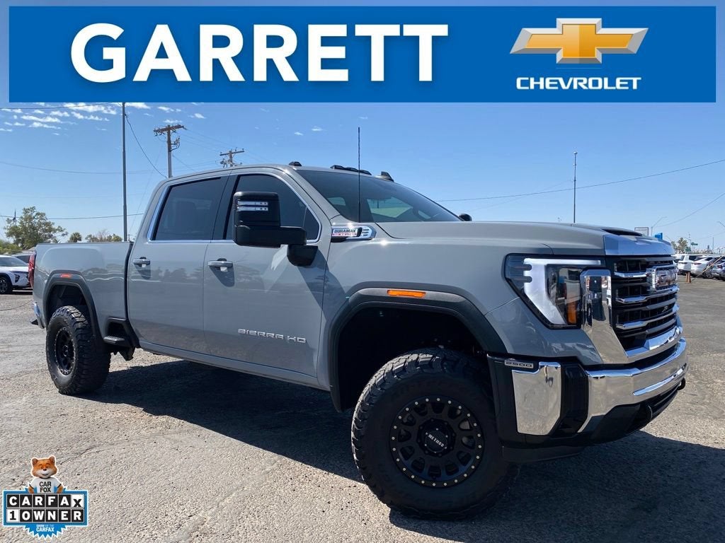 2024 GMC Sierra 2500 HD SLE in Thunderstorm Gray — front three-quarter view