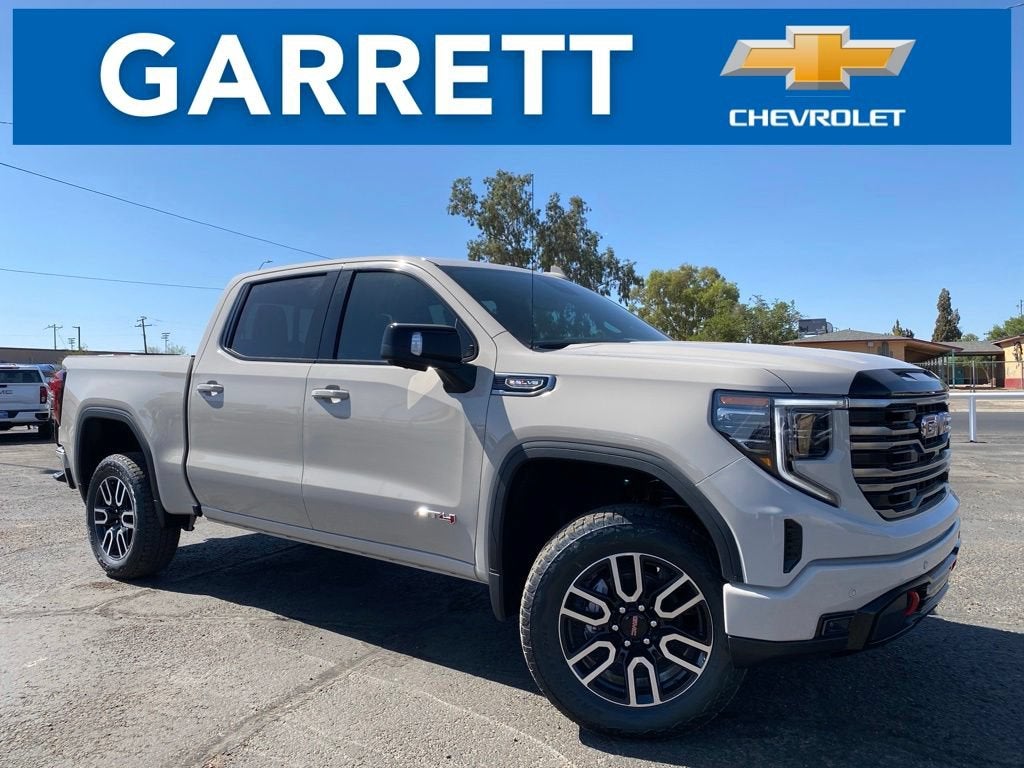 2026 GMC Sierra 1500 AT4 in Coastal Dune — front three-quarter view