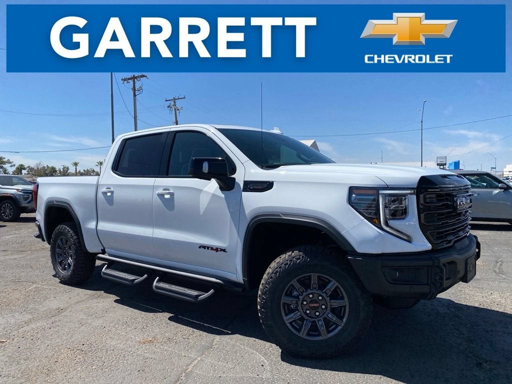 2026 GMC Sierra 1500 AT4X in Summit White — front three-quarter view