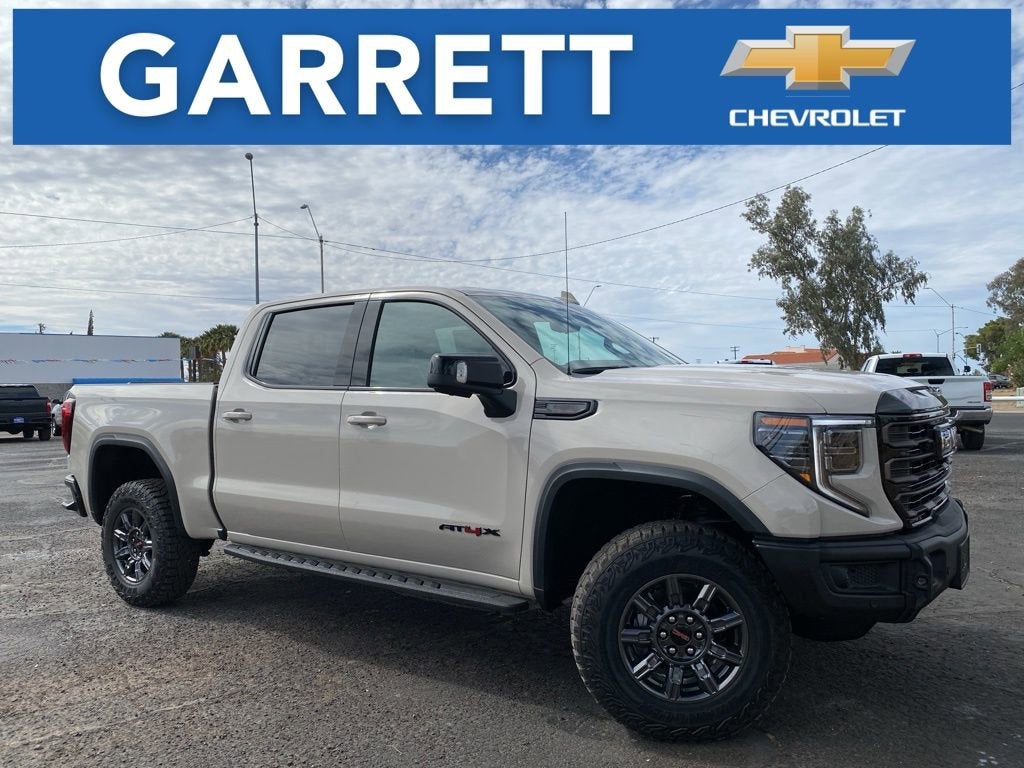 2026 GMC Sierra 1500 AT4X in Coastal Dune — front three-quarter view