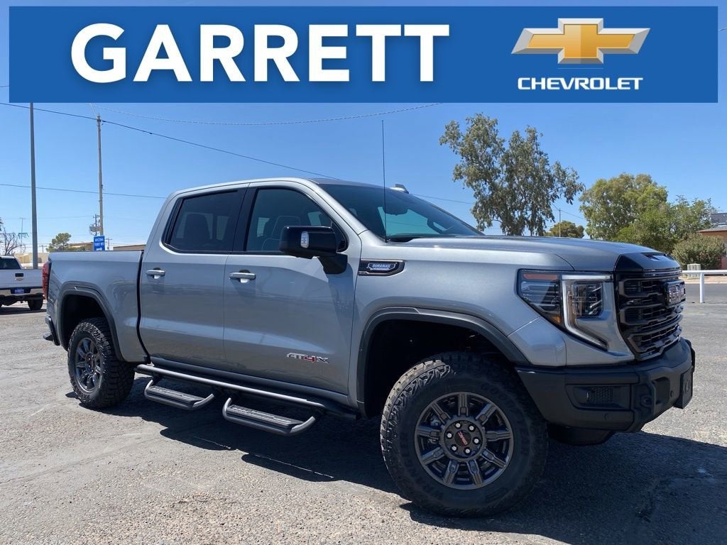 2026 GMC Sierra 1500 AT4X in Sterling Metallic — front three-quarter view