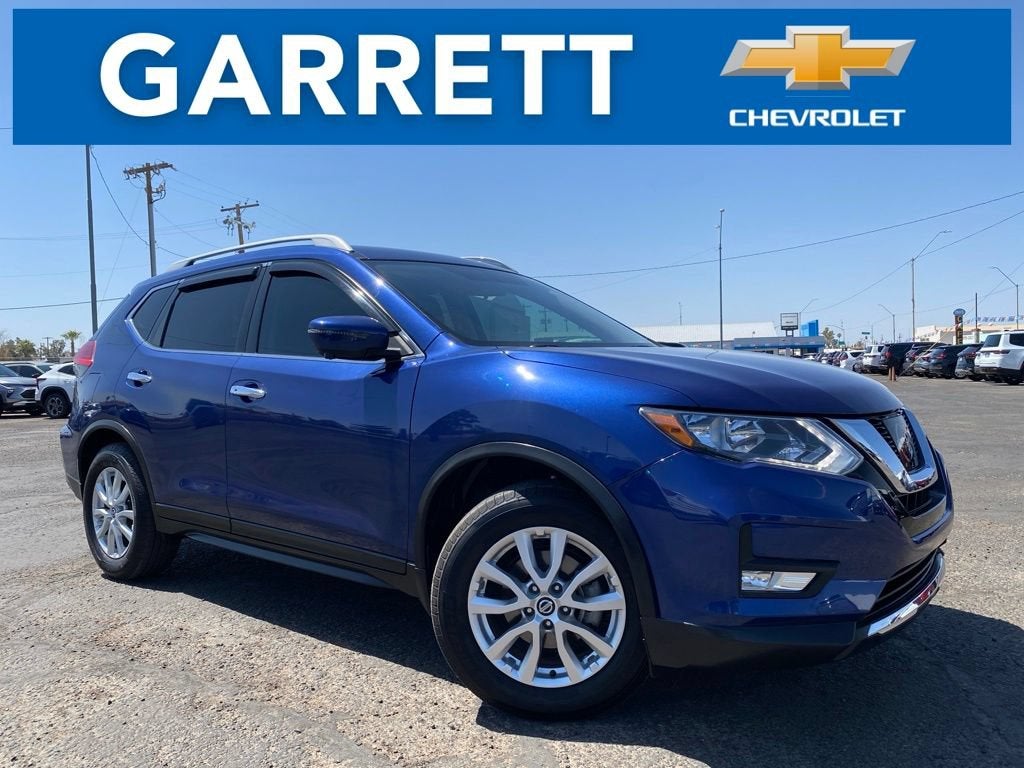 2017 Nissan Rogue SV in Maroon — front three-quarter view
